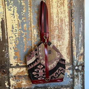 Kilim convertible shoulder to backpack.